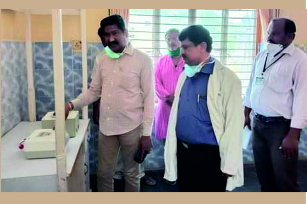 Chittoor District TB control officer Dr B Ramesh Babu examining the TrueNat machine at Madanapalle